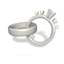 Conjoined platinum wedding rings rotate in this animated clipart.