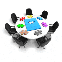 An animation of a blue puzzle piece on a table fitting into the center piece to complete the puzzle.