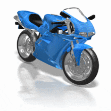 A blue motorcycle swerves as it travels.