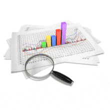 An animation of a magnifying glass looking at three dimensional elements on a data sheet.