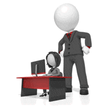 A giant boss watches an employee at her desk.