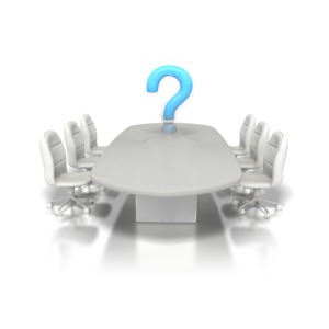 A conference table surrounded by six chairs has a question mark morphing out of its center in this business clipart.