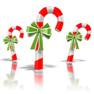 Three delicious red and white striped candy canes with green bows.