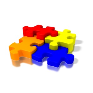 Four colorful puzzle pieces fit together in this concept of parts working together and cooperation and problem solving.
