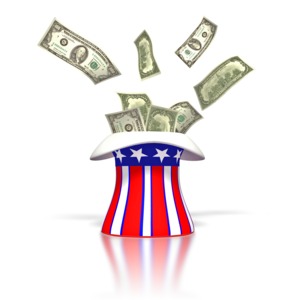 In this clipart Uncle Sams red white and hat hat sits on the ground with money flying out of it.  This graphic clipart could be used presentations dealing with taxes, government, money, tax return and finances.