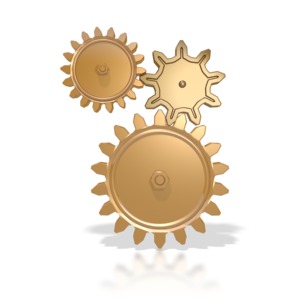 An image of three gold gears working together.  The gears are stacked on top of each other.