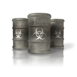 An image of three large industrial barrels with a bio-hazard symbol on the side.  