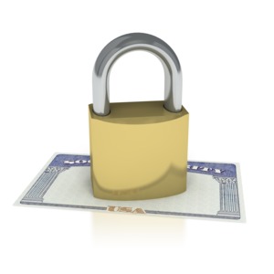 This clipart image shows a lock locked on top of a social security card signifying that social security is secure.  This graphic could be used in presentations about retirement, social security, benefits, and identity.