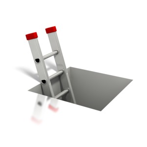 An image of a ladder coming out of a square hole in floor.