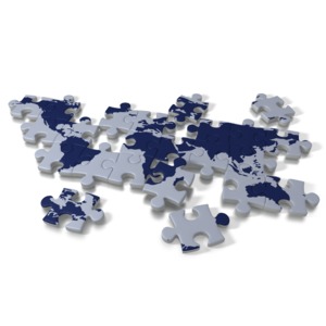 An image of the world on a puzzle.  Several of the pieces of the world are not in place.  A concept of solving the worlds problems or figuring out a global dilemma. 