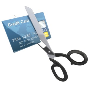 An image of a credit card being cut up by a pair of scissors