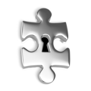 An image of a silver puzzle piece with a key hole in the center.