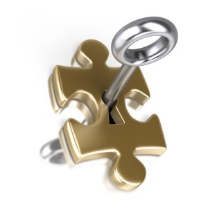 An image of a silver key opening a gold puzzle piece.