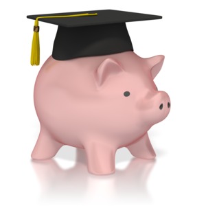 A piggy bank wears a graduation mortarboard hat in this concept image of saving for college or the cost of education.