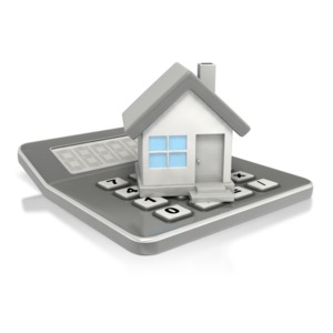 This clip art image shows a calculator with a house resting on top.  This graphic could be used in presentations about housing fiance, bank loans, real estate, and mortgages.