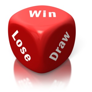 An image of a single red die with the words win, lose, and draw inscribed on three sides.