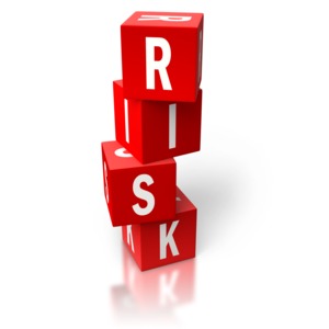 An image of the word risk stacked using red blocks.