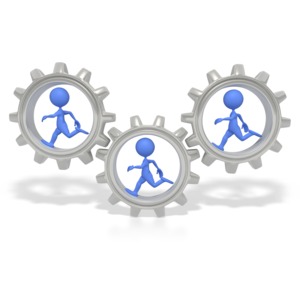 This clip art image shows three gears with blue stick figures running in them.  This graphic would be great for presentations about teamwork.