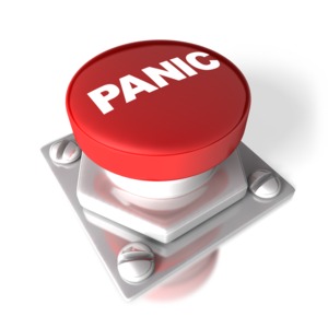 A 3D image of a red push button with the word PANIC in white.  A concept of an emergency or a call for caution or a warning.
