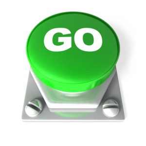 A big green button with the text GO printed on it.  A 3D rendered image.