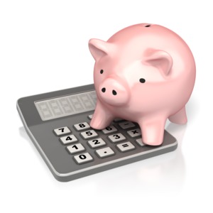 This clip art image shows a piggy bank standing on top of a calculator.