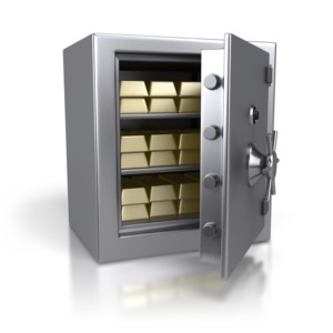 An image of a safe containing stacks of gold bars.