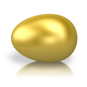 An image of a golden egg laying horizontal. This egg can represent retirement or an animal egg.