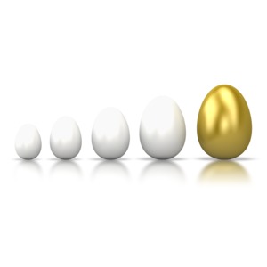 A line of white eggs with a gold egg at the end.