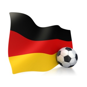 This clip art image shows a German flag with a soccer ball sitting next to it.  