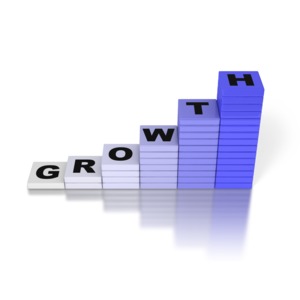 A 3D rendered image of a bar graph with the word growth on the top of the individual bars.  A concept of growth or increasing profit.