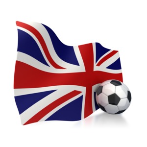 This clip art image shows a Untied Kingdom flag with a soccer ball sitting next to it.  