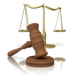 An image of a gavel with the scales of justice in the background.