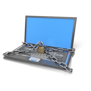 An image of a computer that is locked up with lock and chain.