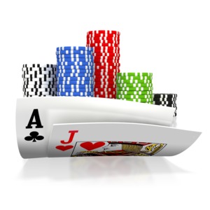 This clip art image shows a twenty one blackjack hand with a stack of chips behind it.