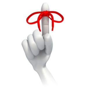A red string is tied around an index finger.  A concept of trying to remember something.