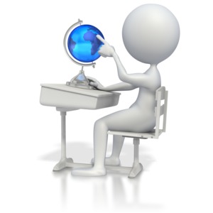 A student sits at a desk while studying a globe.