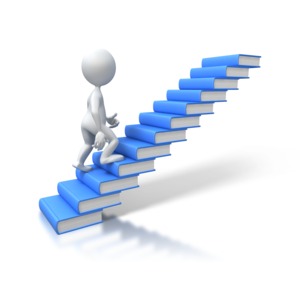 An image of a stick figure walking up steps made from books.