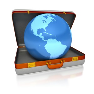 A blue world globe sits inside of a briefcase / suitcase.