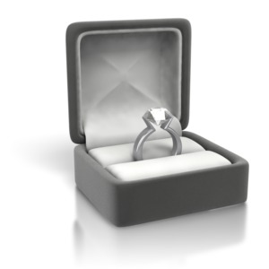 An image closeup of a woman&#039;s silver diamond ring.