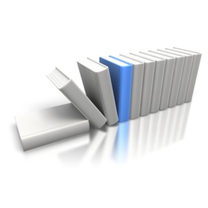 An image of a blue book standing out from the rest with books tipping over.