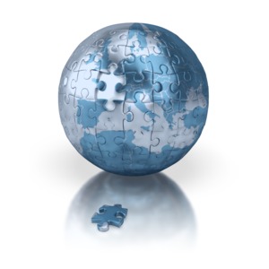 A globe centered on Europe with a piece missing.  A clip art concept of solving a global problem of finding the missing piece of the puzzle.