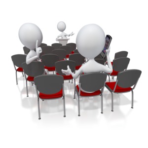 A stick figure shushes another talking on a cell phone while listening to a presentation.