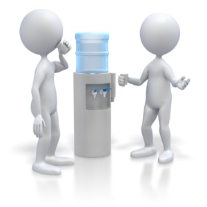 Two stick figures converse by a water cooler in this clip art image.    