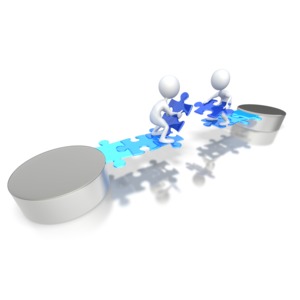 Two stick figures lay the last puzzle pieces to complete a bridge connecting there sides together.