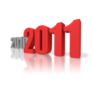 The year 2010 gives way to 2011 in this year end concept. The years 2010 and 2011 are 3D rendered in large block fonts.