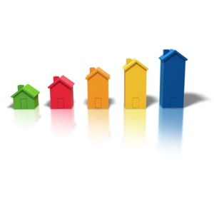 An image of five multi colored houses increasing in size from left to right.