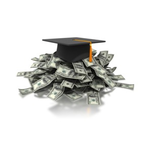 An image of a graduation cap on top of a large pile of US Dollars.