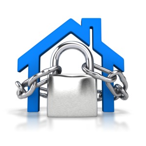 A stylized 3D clipart image of a house secured by a large lock and chains.  A concept of home security or protecting your home.