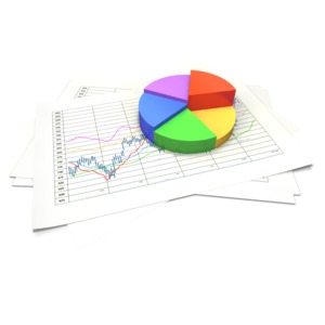 An image of a three dimensional pie chart with data sheets.