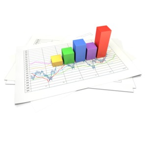 An image of a three dimensional block pie chart with data sheets.